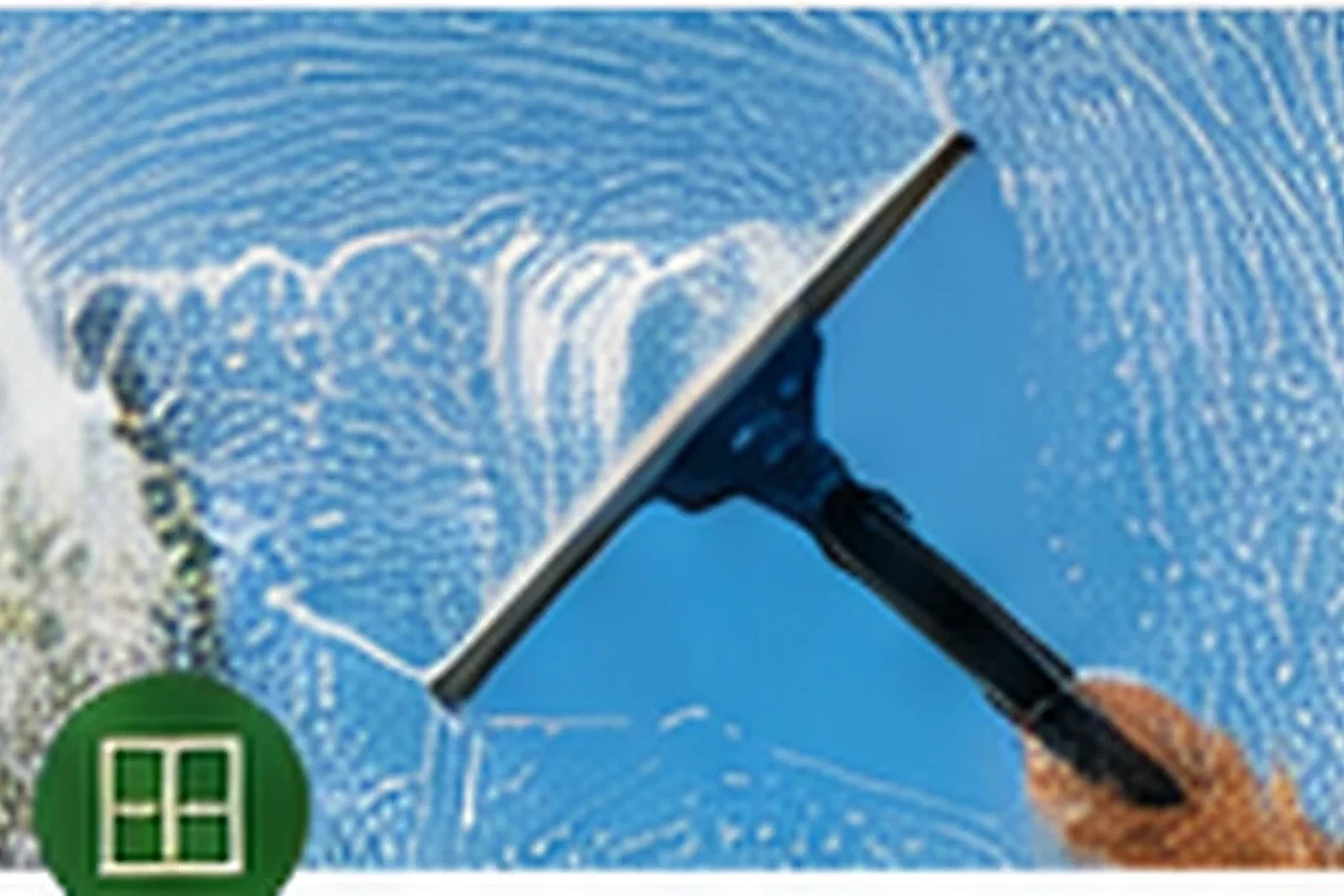 Professional squeegee cleaning on clear glass